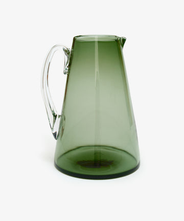Gemma Jug. Transparent smoke-green hand-blown glass jug with clear handle, alt side view.