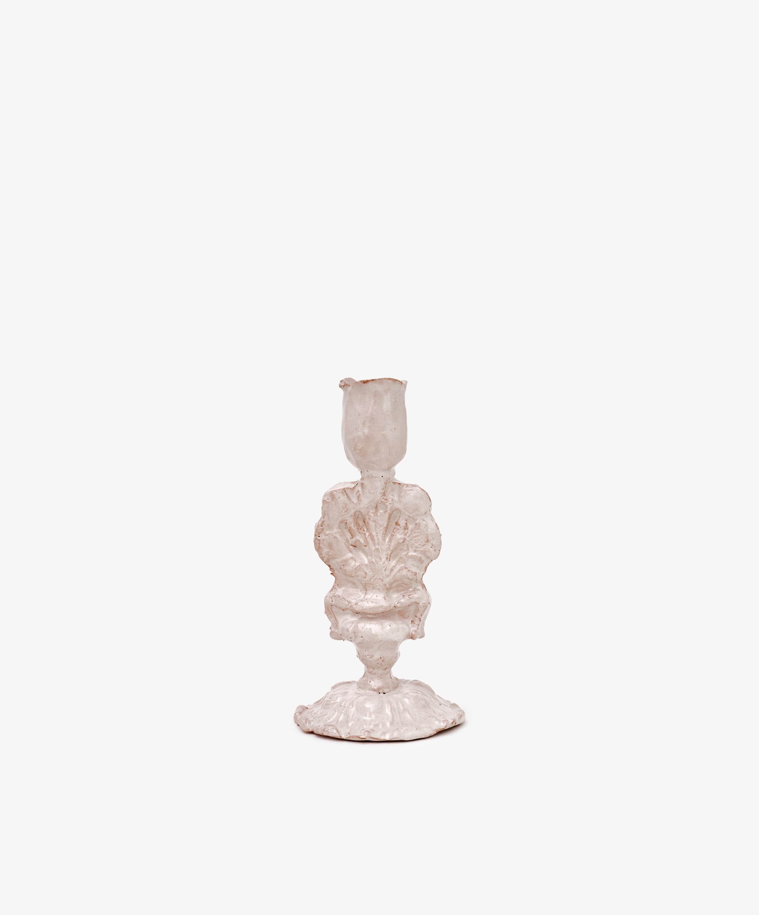The Jarra De Flores Candleholder is a hand-moulded white ceramic piece with a shell-inspired sculptural form, shown against a plain white background.