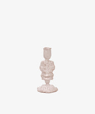 The Jarra De Flores Candleholder features an ornate, vintage-inspired white design with sculptural details, reminiscent of hand-moulded glazed pieces, shown against a plain white background.