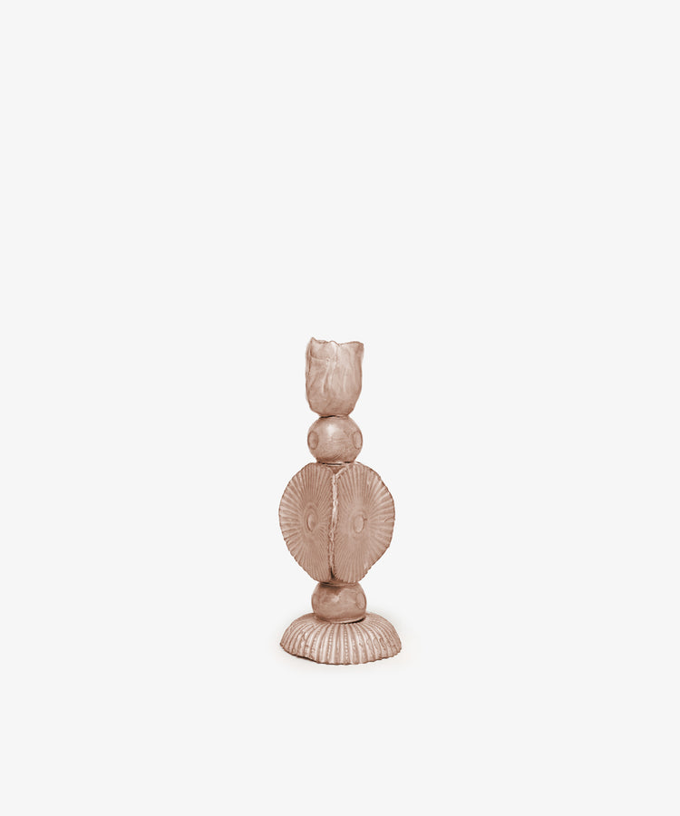 The Circulo Candleholder is a sculpted, abstract ceramic figure with round forms, a textured base, and a small cylindrical top, reminiscent of modern sculptural design and shown against a plain white background.