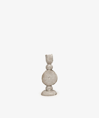 The Circulo Candleholder is a hand-moulded ceramic piece featuring a circular, ridged design and sculptural form, shown against a plain white background.