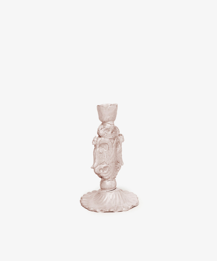 The Aguila Bicefala Candleholder features an ornate, sculptural design with decorative detailing, showcased standing upright against a white background.
