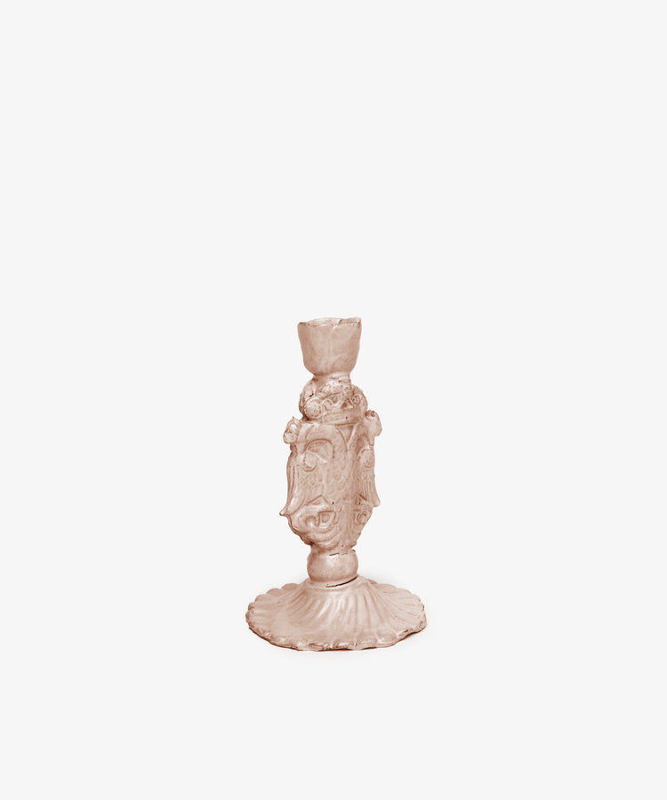 The Aguila Bicefala Candleholder is a bronze-colored ornate piece with a sculptural form, decorative base, and detailed carvings, displayed against a plain white background.
