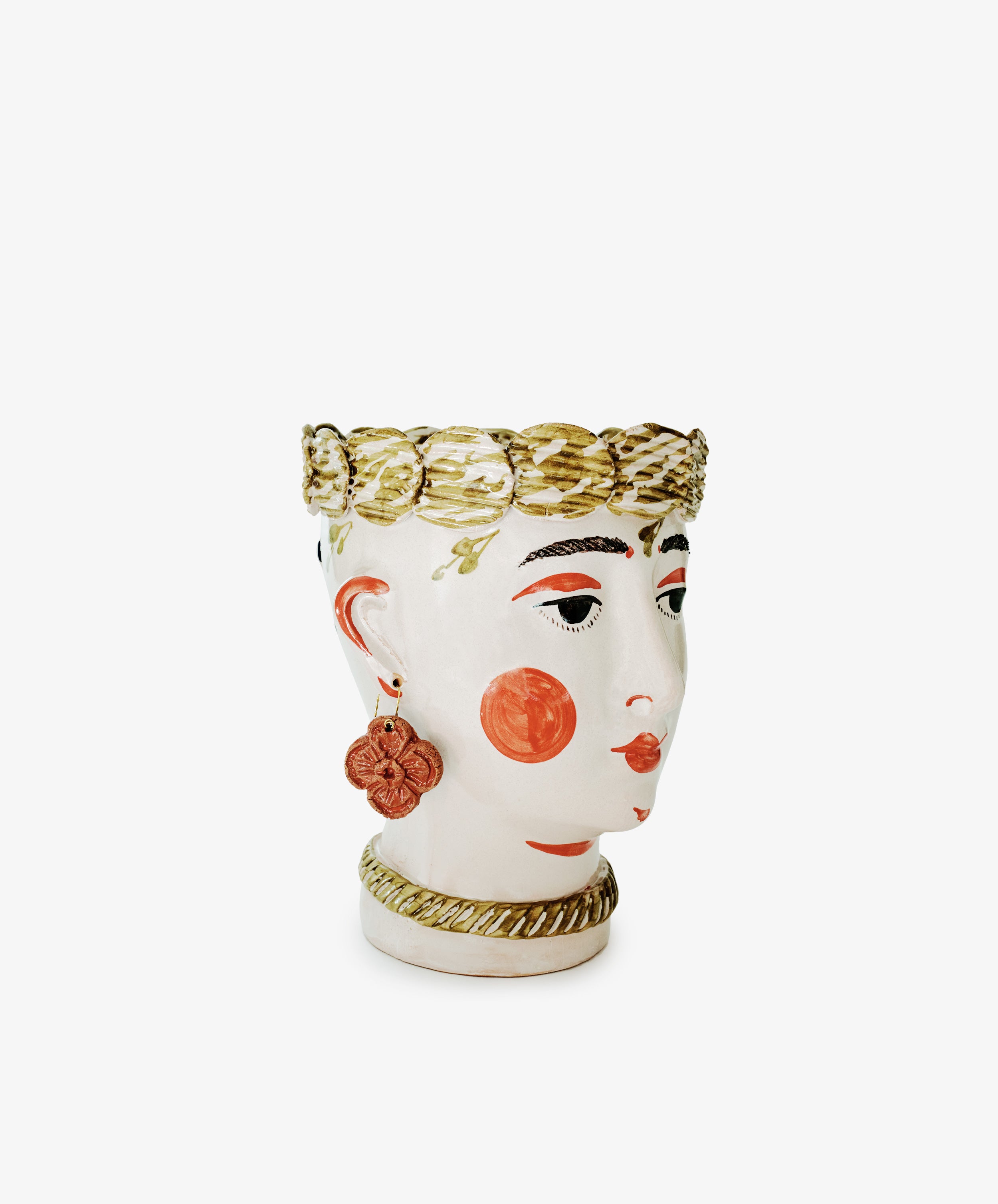 Cabeza Recipiente, Biloba: A ceramic vase shaped like a human head with painted features, gold-tone hair and necklace, and a decorative earring—a bold handmade decor piece inspired by The Exvotos.