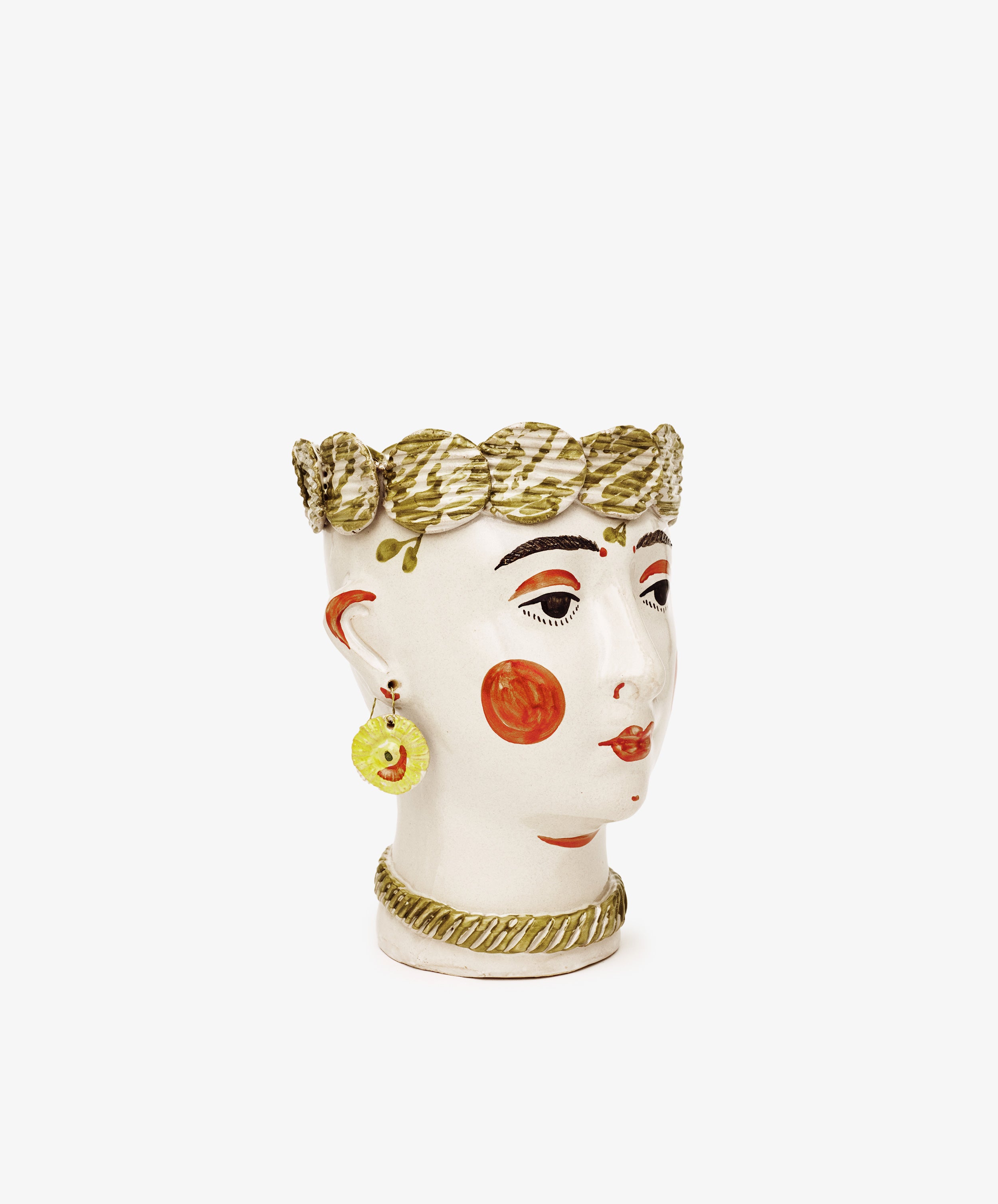 The Testa di Moro, Biloba is a ceramic vase shaped like a stylized human head with painted features, red cheeks, an ornate patterned crown, and yellow earring—an eye-catching sculptural piece for your homeware collection.