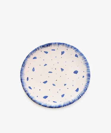 Ola Decorative Platter by The Exvotos. White glazed ceramic plate with painted blue abstract design.