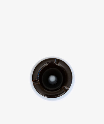 Top view of the Mix & Match Ashtray, a chunky ceramic piece handmade in Italy with three cigarette rests, centered on a white background.