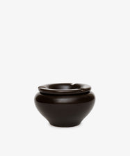 The Mix & Match Ashtray is a glossy dark brown ceramic piece with a chunky, wide rounded base and three rim notches, handmade in Italy and shown against a plain white background.