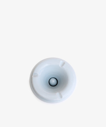 Top view of the Mix & Match Ashtray, a white ceramic piece with a single center hole, resembling a chunky ashtray, placed on a plain white background.