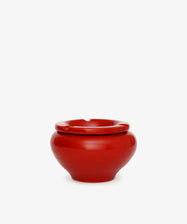 The Mix & Match Ashtray is a glossy, chunky ceramic piece with a rounded shape and a single rim notch, handmade in Italy and shown against a plain white background.