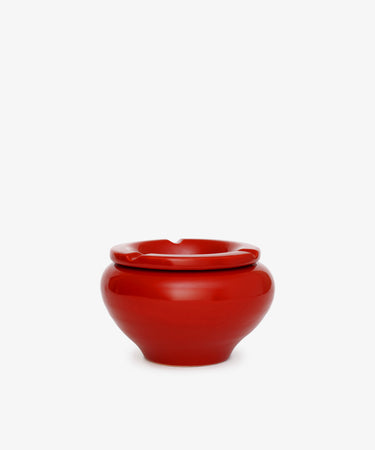The Mix & Match Ashtray is a glossy, chunky ceramic piece with a rounded shape and a single rim notch, handmade in Italy and shown against a plain white background.
