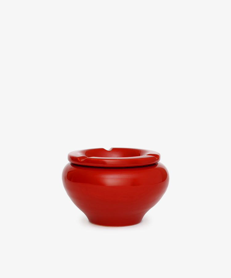 The Mix & Match Ashtray is a glossy, chunky ceramic piece with a rounded shape and a single rim notch, handmade in Italy and shown against a plain white background.