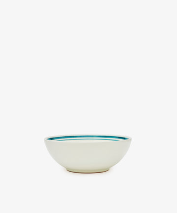 The Folk Cereal Bowl, Horse is a hand-painted Italian ceramic bowl with a white body and blue inner rim, shown on a plain white background. Ideal for mixing and matching with your favorite tableware.