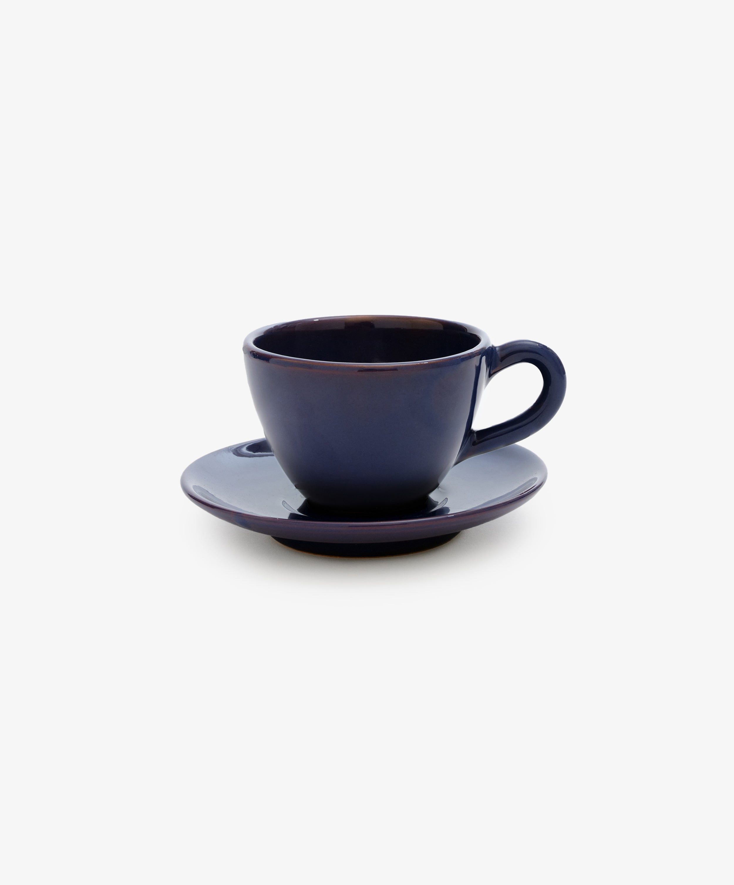 Guido Coffee Set by Enza Fasano. Purple-blue glazed ceramic cup and saucer.