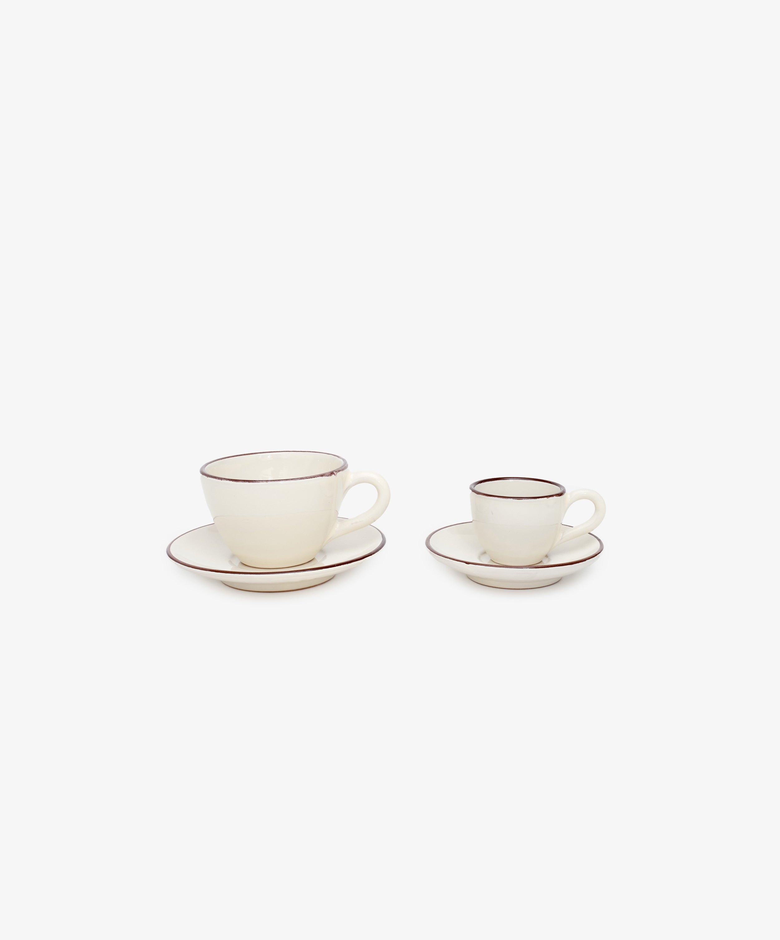 Guido Coffee Set and espresso set side by side, in white glazed ceramic with painted burgundy striped border.