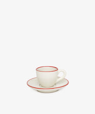 The Gio Espresso Set features a handmade ceramic espresso cup with a handle, resting on a matching saucer and plate—each edged with a slim red line—displayed against a plain white background.