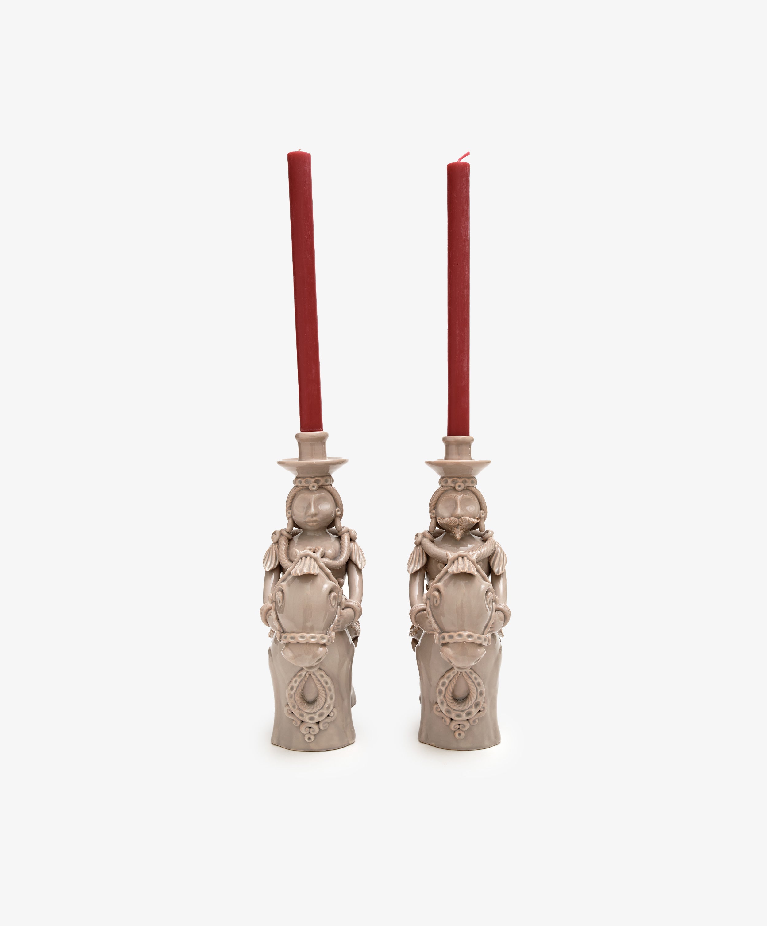 Pair of large Bello and Bella Horseman Candelabras, front view with red taper candles.