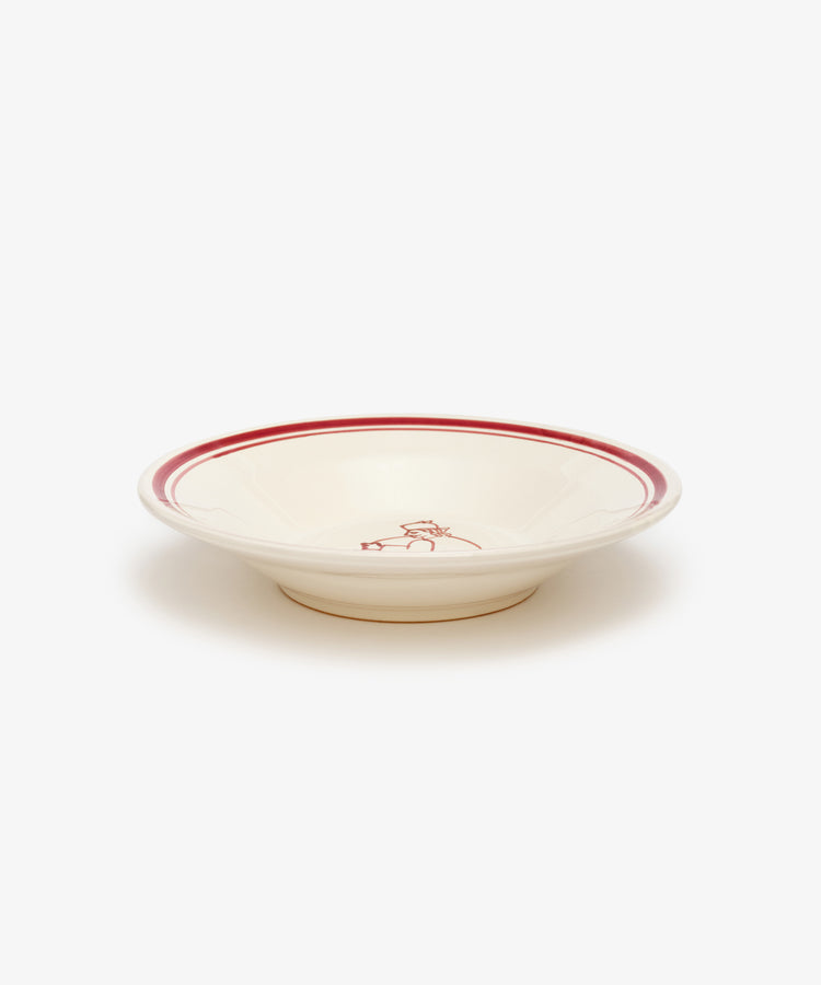 The Folk Pasta Bowl, Farmer features a cream color with a red rim and central red design. Crafted by an Italian ceramist, this elegant shallow dish is displayed against a plain white background.