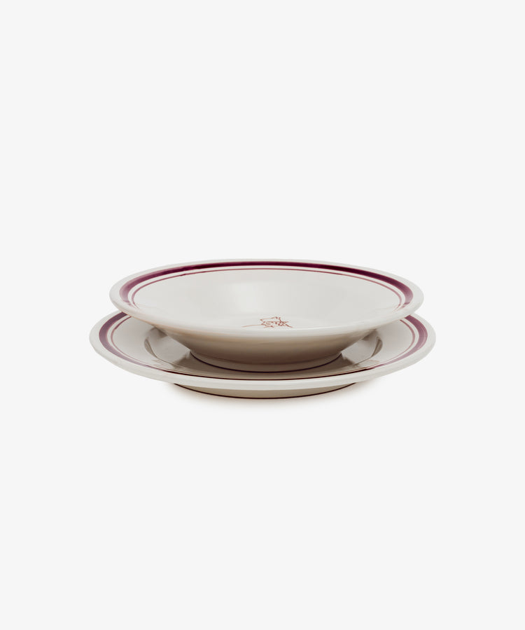 Two hand-glazed Folk Pasta Bowls, Farmer edition, featuring a maroon-striped rim and small central emblem, stacked on a white background—elegant ceramic tableware designed for refined dining.