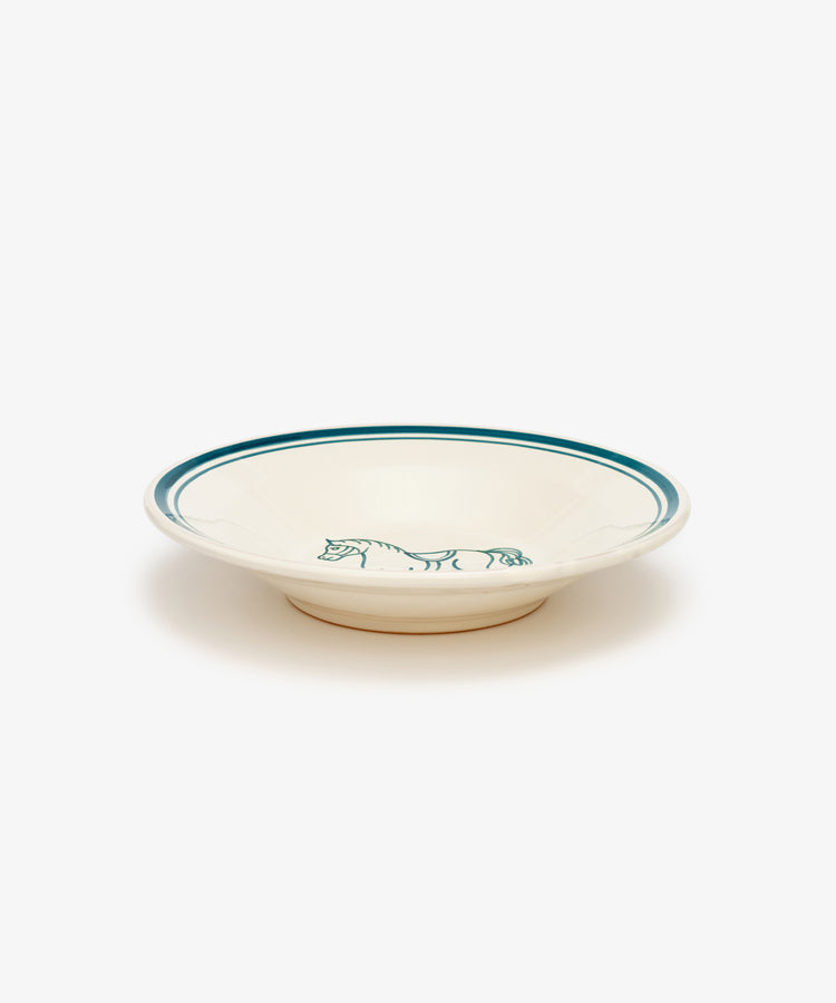 The Folk Pasta Bowl, Horse, is a shallow cream-colored ceramic plate with a green rim and a hand-painted simple green horse illustration on the inner edge.