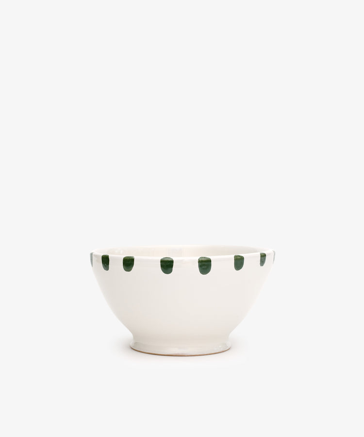 The Nina Bowl, Set of 4, features white ceramic bowls with evenly spaced green dots on the rim. Pair with the matching small plate for a coordinated look.