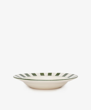 The Julius Serving Platter is a shallow, cream-colored ceramic bowl with bold green vertical stripes around the rim, photographed on a white background—perfect for adding easy sophistication to any table.