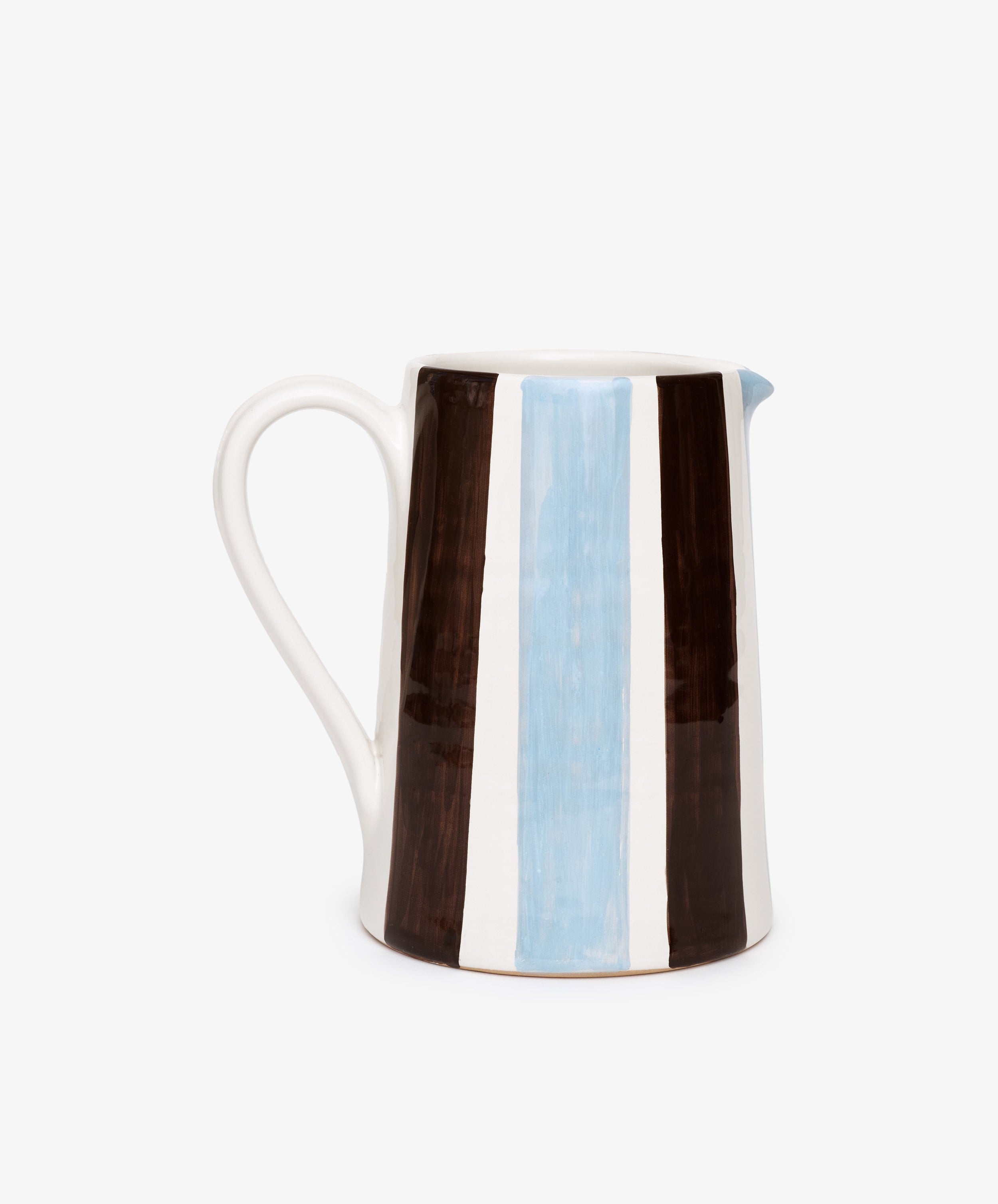 The Mina Jug is a hand-painted Italian pitcher with a handle, featuring vertical brown, white, and light blue stripes on a white background—perfect for adding charm to any setting.