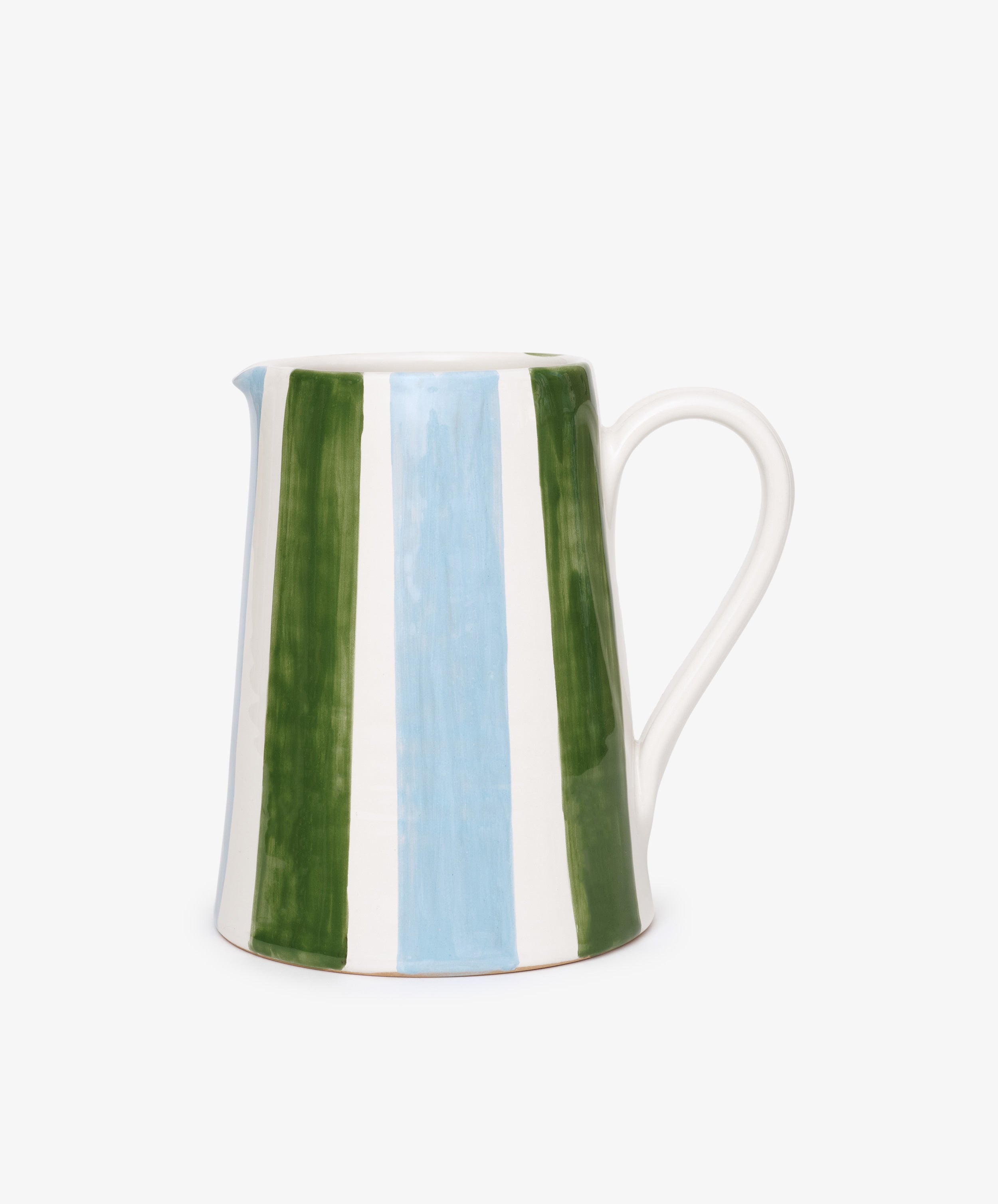 The Mina Jug is a white ceramic pitcher with a curved handle, hand-painted with elegant vertical green, blue, and white stripes—an Italian design shown against a plain white background.