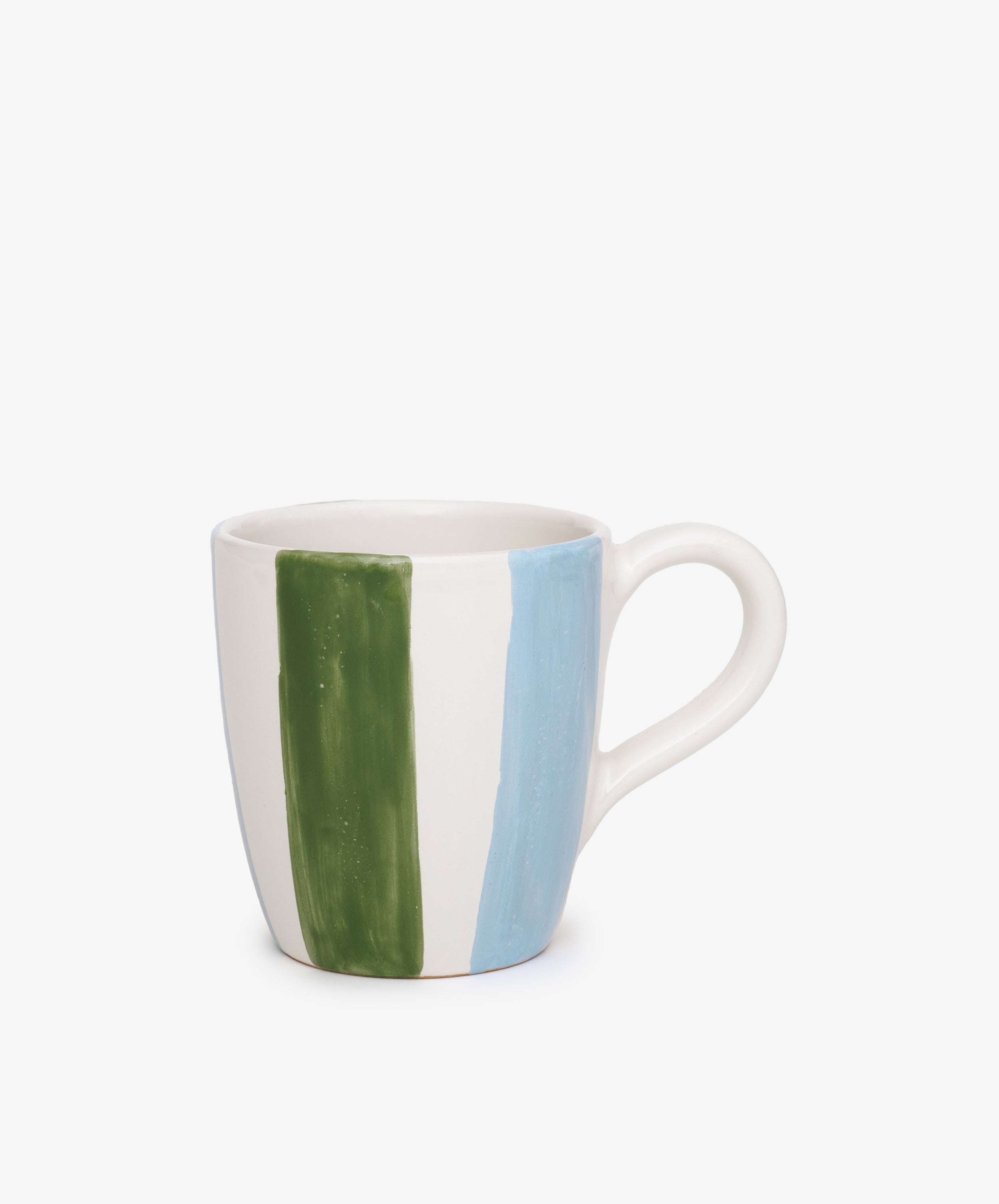 The Mina Mug is a white ceramic mug, hand-painted with vertical green and blue stripes inspired by Mediterranean designs, displayed on a plain white background.