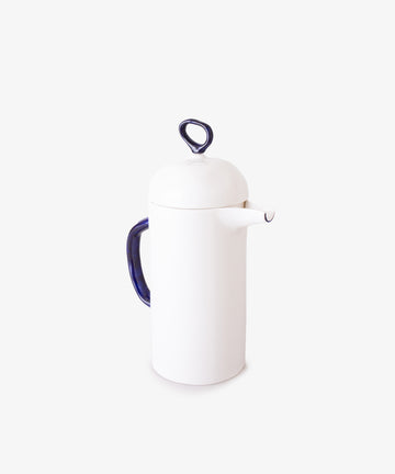 The Cafetière is a white bone china coffee pot with a blue handle and matching lid featuring a looped knob, perfect for elevating your daily coffee ritual. Shown against a plain white background.