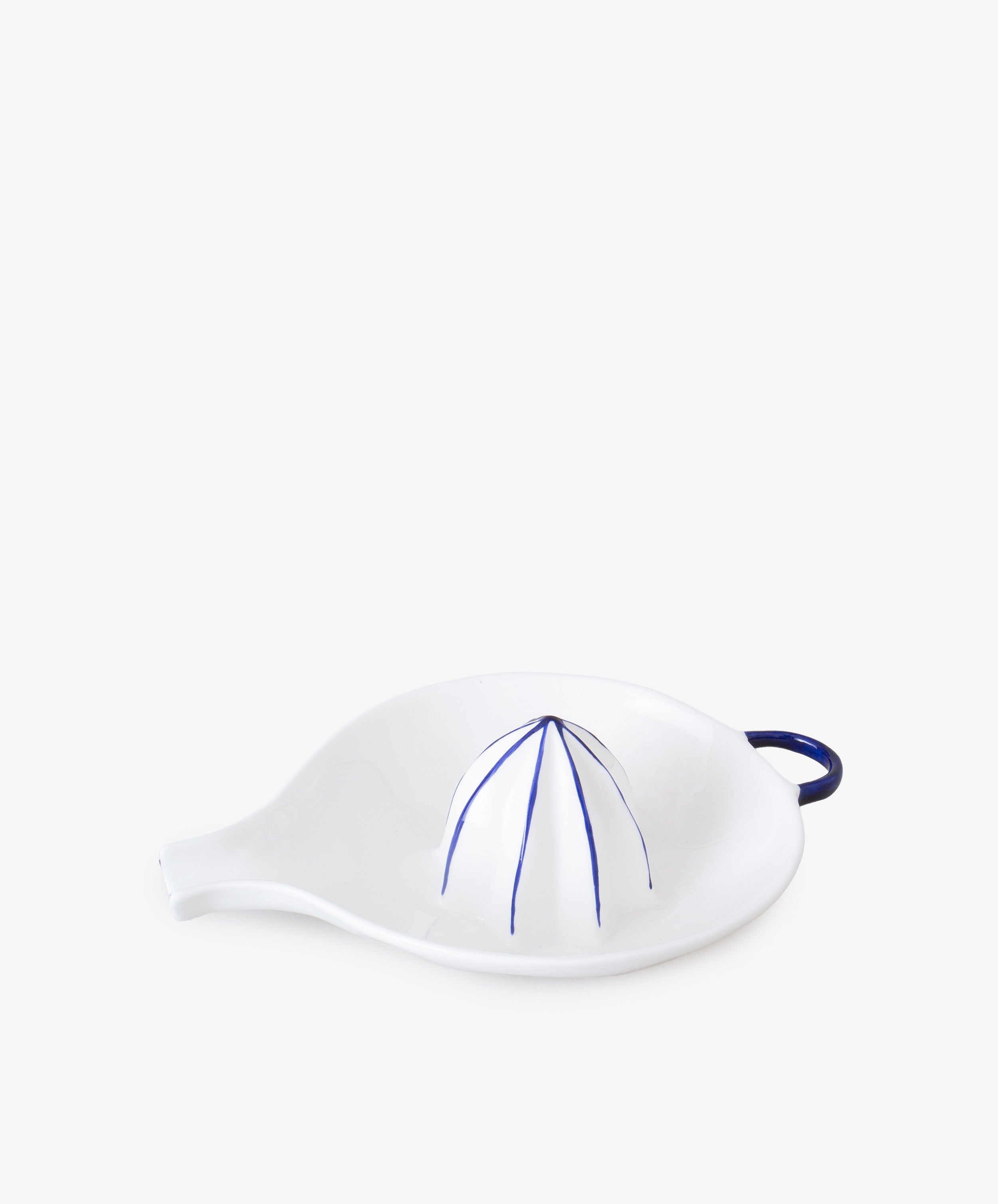 Juicer by Feldspar. White china hand-held citrus squeezer with painted blue accents.