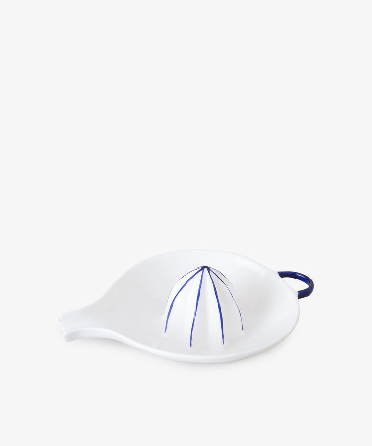 Juicer by Feldspar. White china hand-held citrus squeezer with painted blue accents.