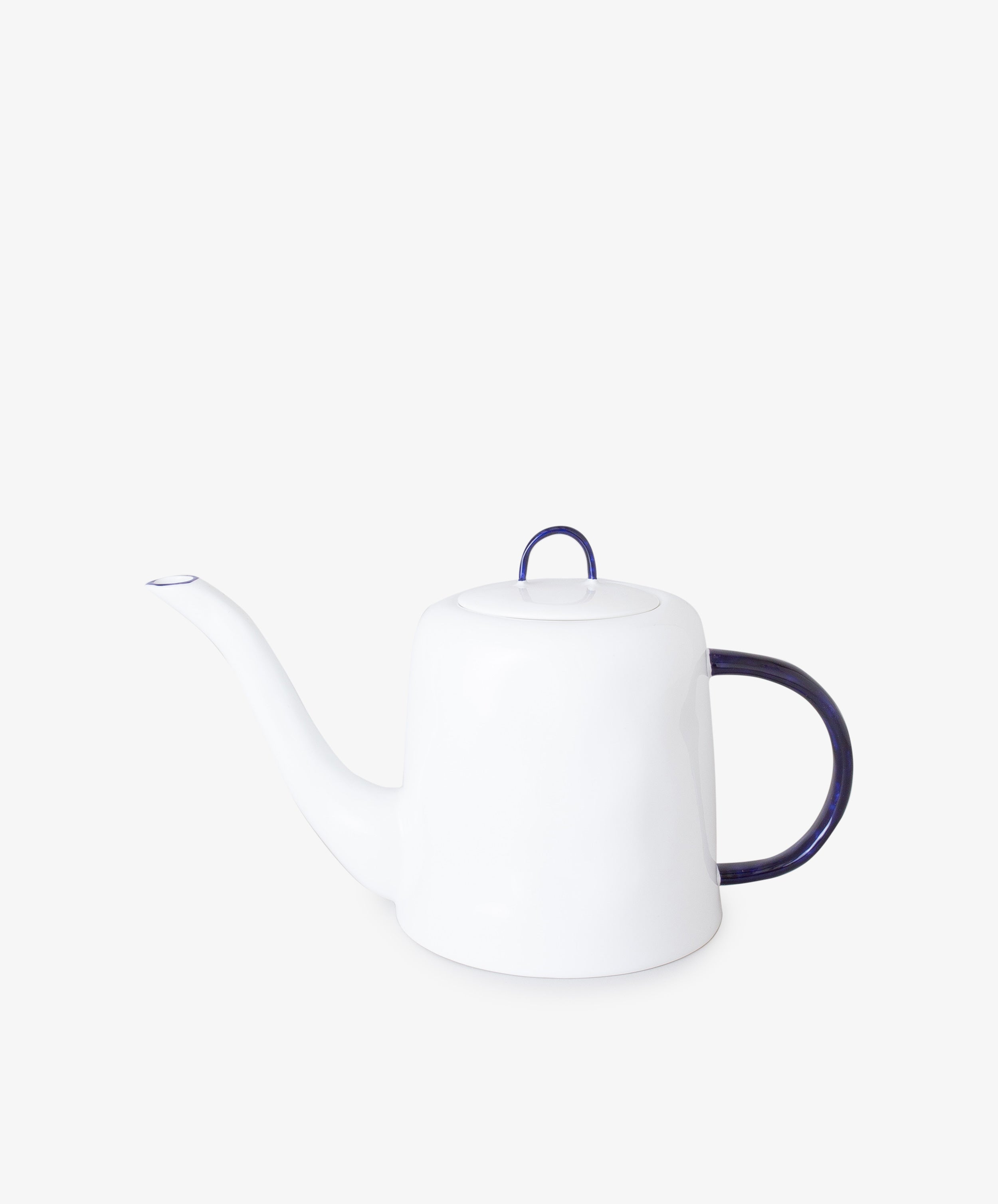 Teapot by Feldspar. White china pot with cobalt blue painted handle and long, thin spout