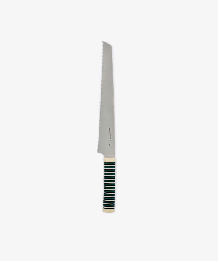 The Bread Knife, featuring a sharp serrated edge and a black and white striped handle, is displayed against a plain white background.