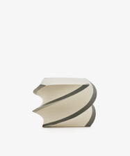 Introducing the Spiral Notepad: an off-white, sculptural stool with a twisted spiral design inspired by the product’s namesake, highlighted with gray accents and presented against a clean white backdrop.