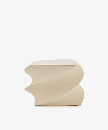 Beige, square-shaped “Spiral Notepad” side table featuring a twisted, sculptural design inspired by the look of a helix notepad, displayed against a plain white background.