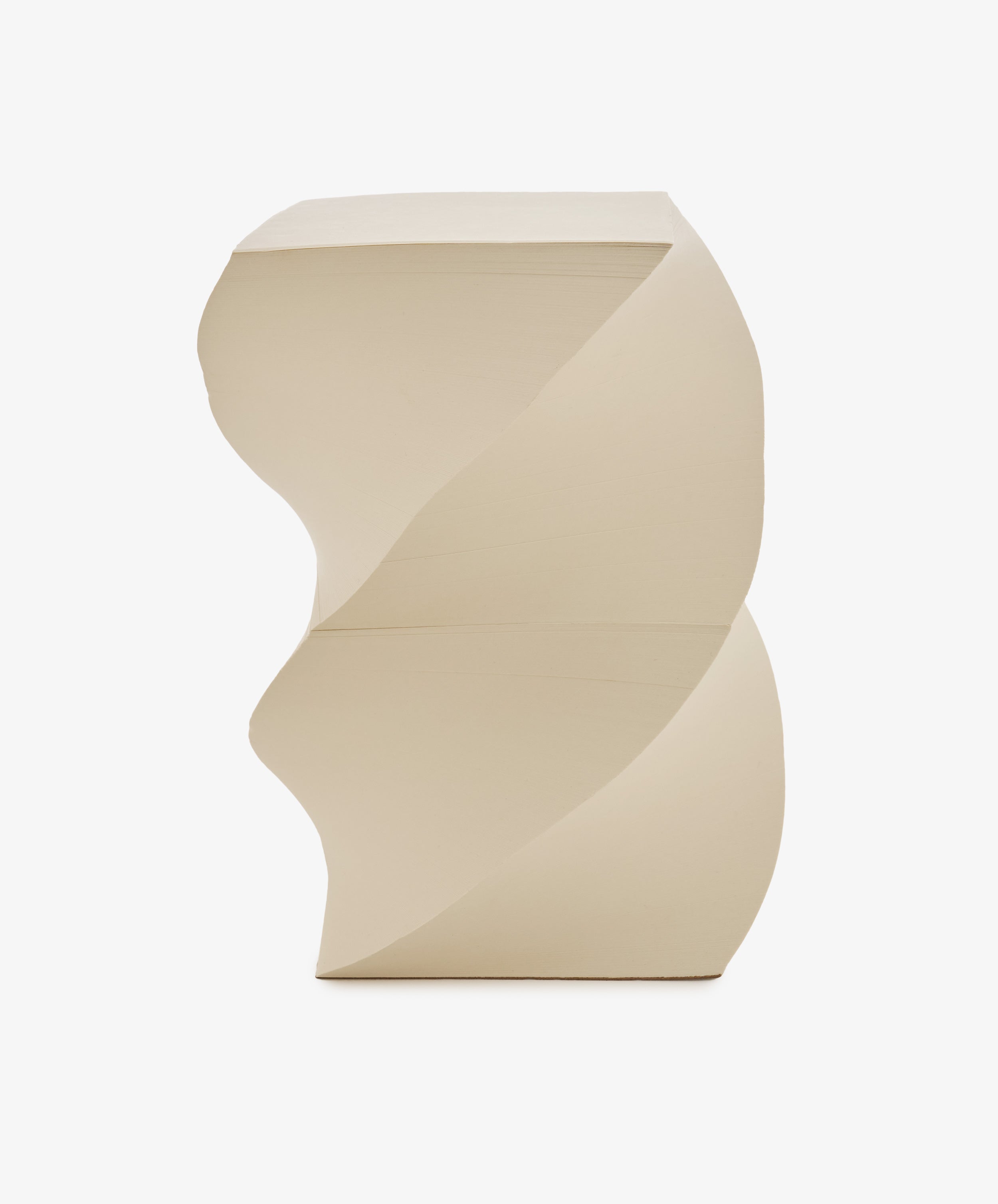 The Spiral Notepad features a beige sculptural design with geometric, spiral-like curves reminiscent of a helix, and a flat top and base, shown against a plain white background.