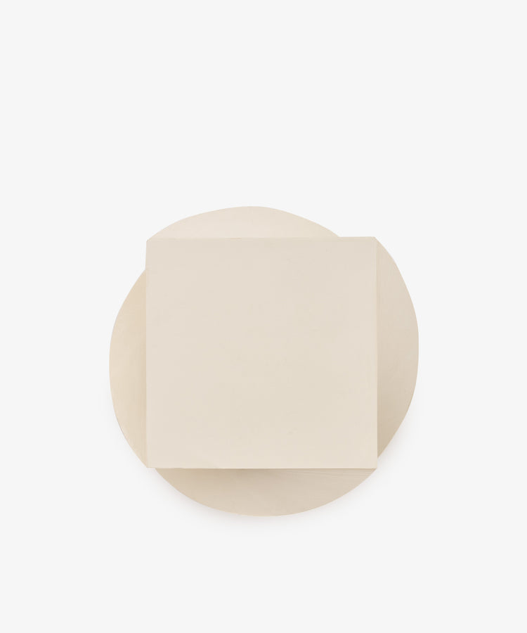 A round white Spiral Notepad, topped with a single square white Spiral Notepad, both set against a plain white background, creates a layered look reminiscent of a unique paper design.