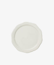 The Cirrus Scalloped Plate, crafted in elegant creamware, is shown from above on a white background.