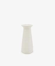 The Cirrus Bud Vase, a plain white ceramic piece featuring a wide, flat rim and a gracefully tapered body inspired by the elegant forms of Frances Palmer’s Cirrus collection, is displayed on a white background.
