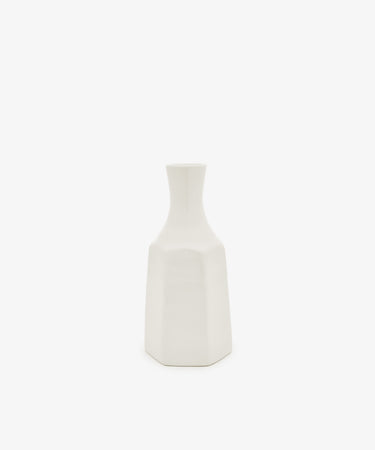 The Cirrus Bud Vase by Frances Palmer is a small, white ceramic piece featuring a geometric design with a narrow neck and hexagonal base, showcased against a plain white background.