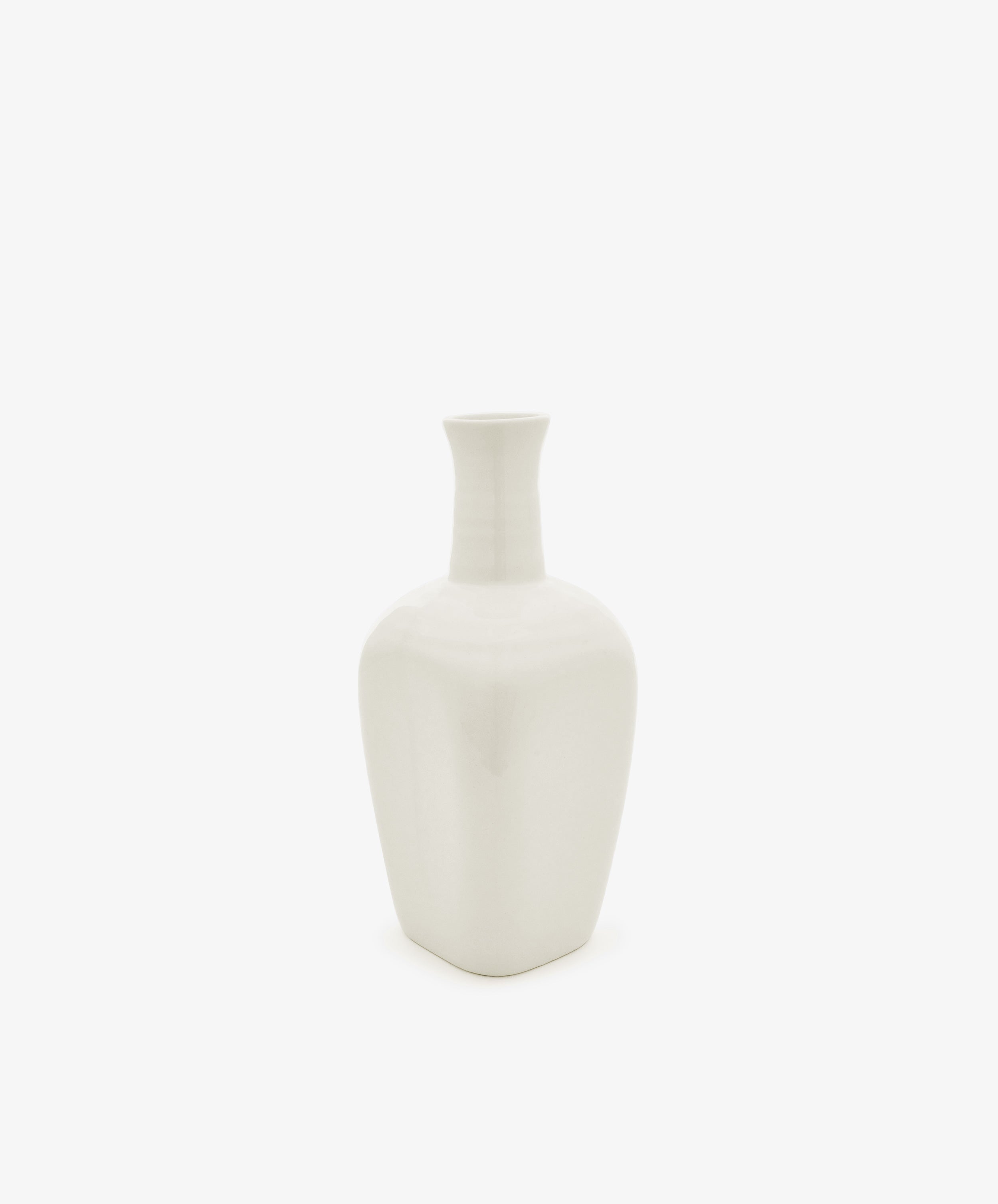 The Cirrus Bud Vase, crafted from white ceramic with a narrow neck and square base, is displayed against a plain white background in the elegant style of Frances Palmer.
