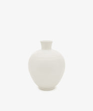 The Cirrus Bud Vase, featuring a white, round ceramic design with a narrow neck and wide body, is shown against a plain white background.