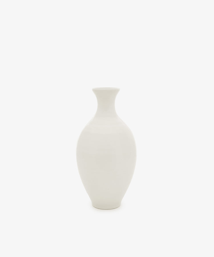 The Cirrus Bud Vase, featuring a rounded ceramic body and narrow neck in a minimalist white finish, is centered against a white background.