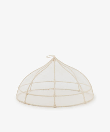 The Viola Foodcover is a handwoven mesh dome with a small loop handle, designed to protect food from insects—ideal for outdoor dining.
