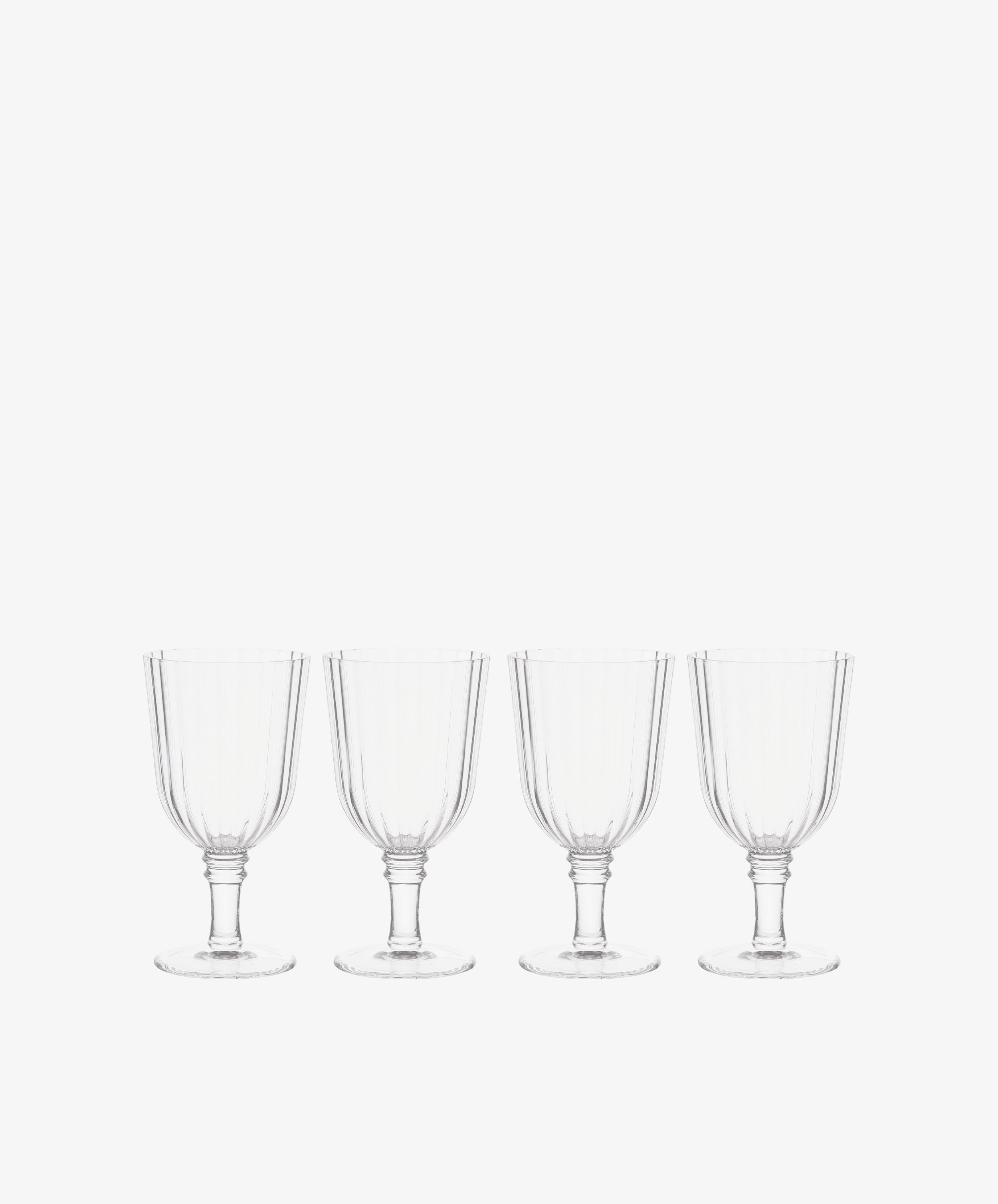 The Fresco Goblet, Set of 4, features acrylic glass goblets in a sleek row on a white background—perfect for outdoor drinkware or elevating your holiday tableware.