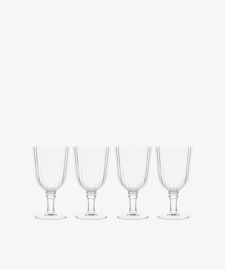 The Fresco Goblet, Set of 4, features acrylic glass goblets in a sleek row on a white background—perfect for outdoor drinkware or elevating your holiday tableware.