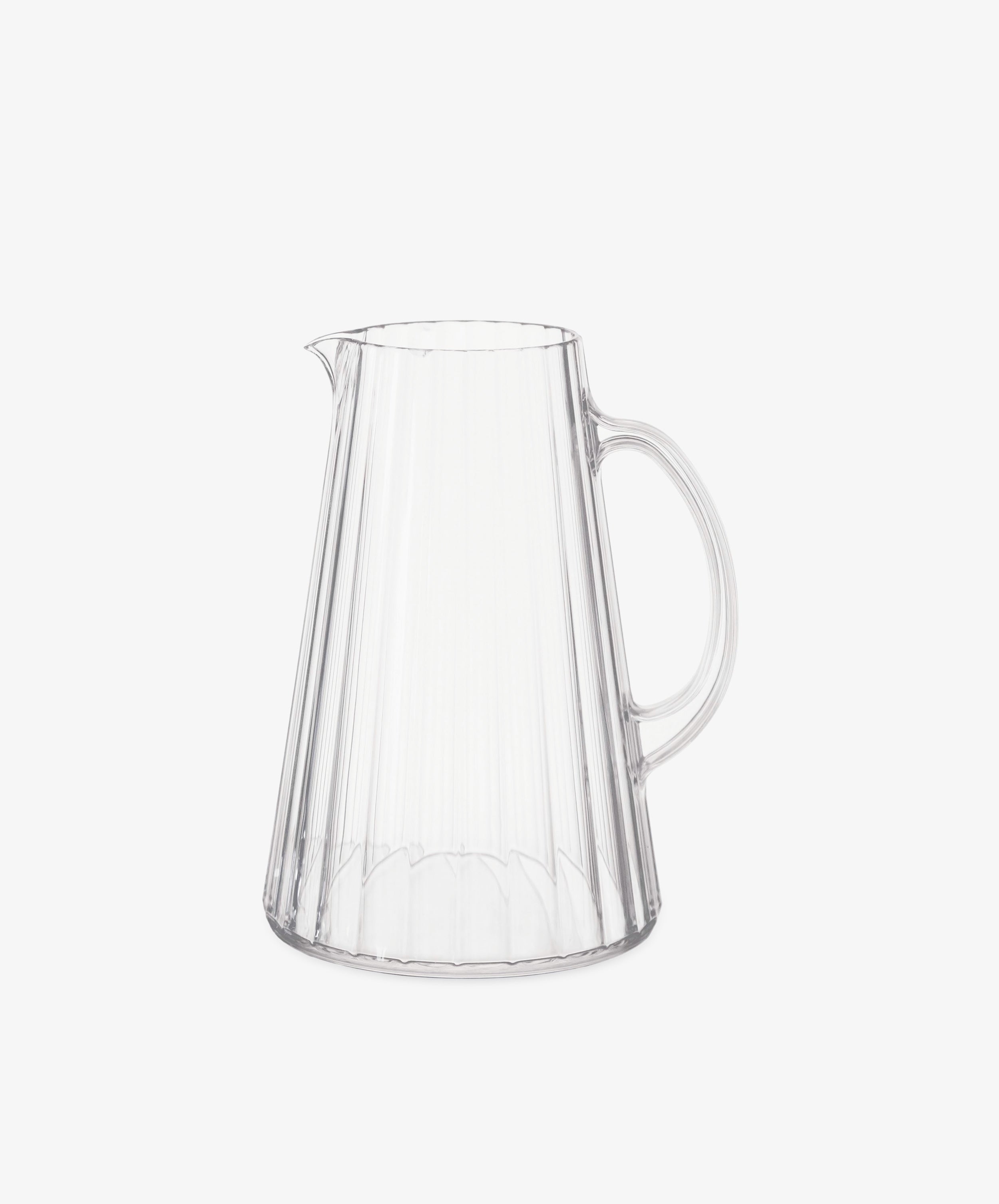 The Fresco Pitcher is a clear acrylic glass pitcher with a handle and vertical ribbed design, inspired by Italian café glassware, shown on a plain white background.