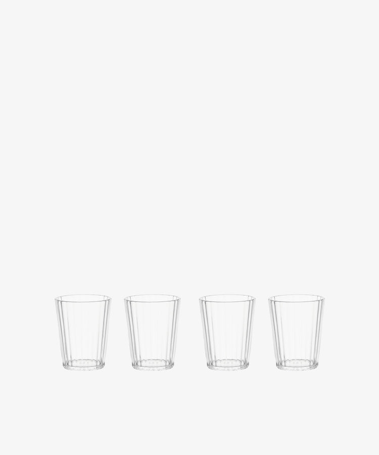 The Fresco Tumbler, Set of 4, features clear, faceted acrylic glasses arranged in a row against a plain white background—stylish and durable drinkware for any occasion.