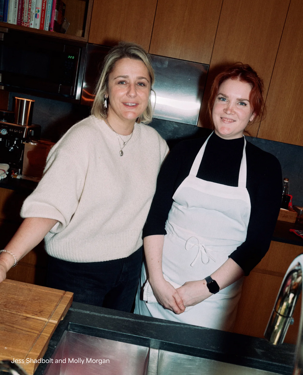 two woman smiling at the camera